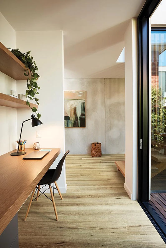 Natural Oak Vinyl Plank Nevada Plain in a light-filled home study with timber desk and pendant lamp