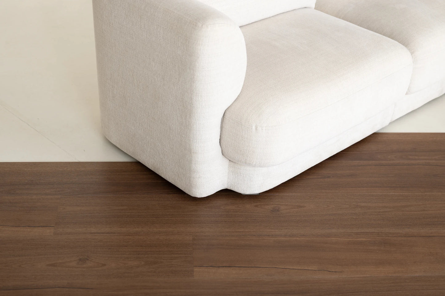 Coastal Collection Maleny Spotted Gum luxury vinyl plank flooring with a cream boucle sofa in a Sunshine Coast living room