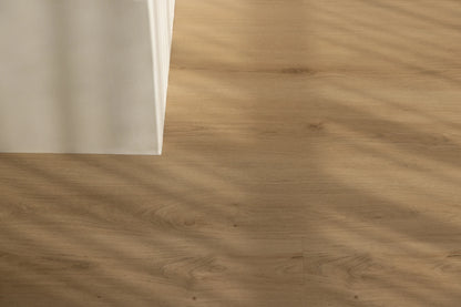 Coastal Collection Minyama Oak luxury vinyl plank flooring with a cream boucle sofa in a Sunshine Coast living room