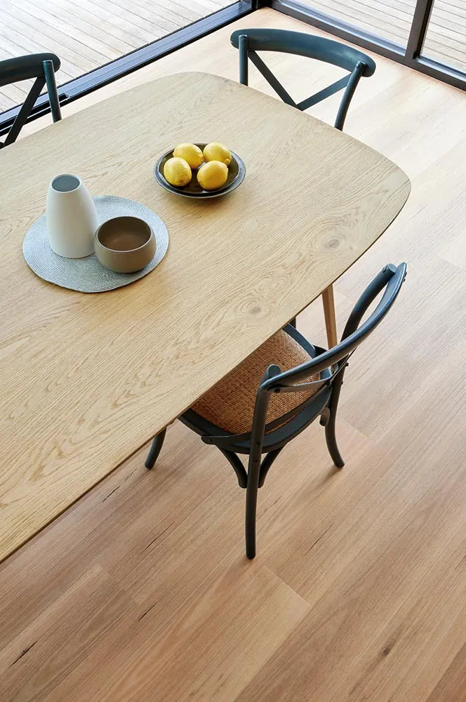 Australian Vinyl Plank Blackbutt in a light-filled dining room with cross-back chairs and natural styling