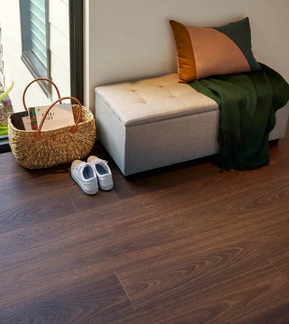Australian Vinyl Plank Jarrah in a modern hallway with a storage ottoman and considered finishes