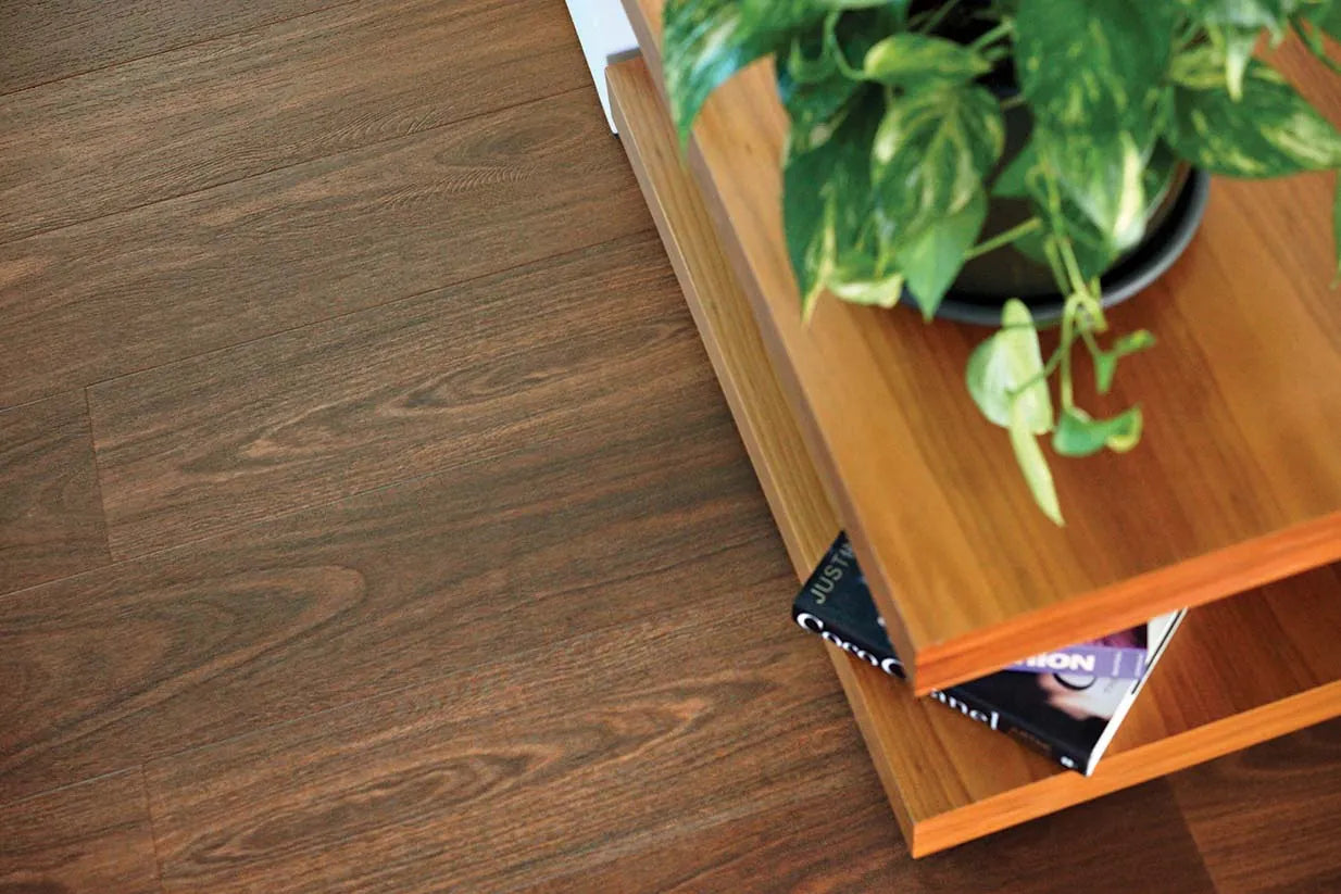 Australian Vinyl Plank Southern Spotted Gum in a modern bedroom with abstract artwork and layered textiles