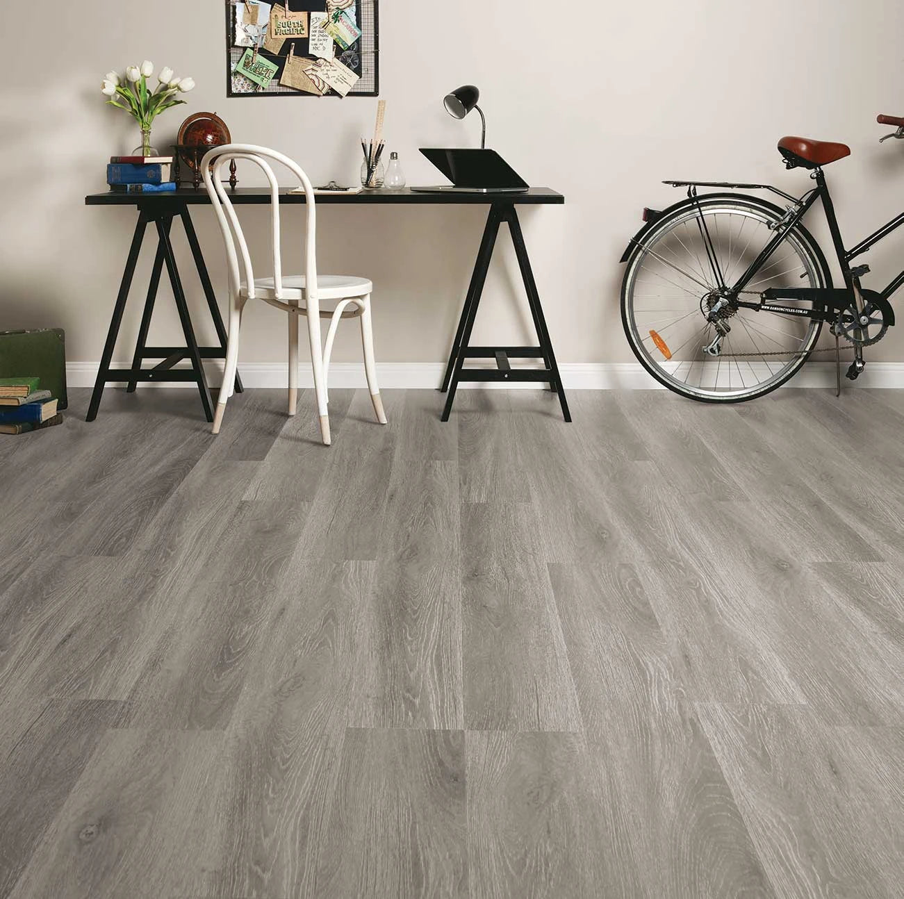 Highland Oak Hybrid Plank Sterling Fall in a home study with a trestle desk, bentwood chair and bicycle