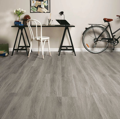 Highland Oak Hybrid Plank Sterling Fall in a home study with a trestle desk, bentwood chair and bicycle