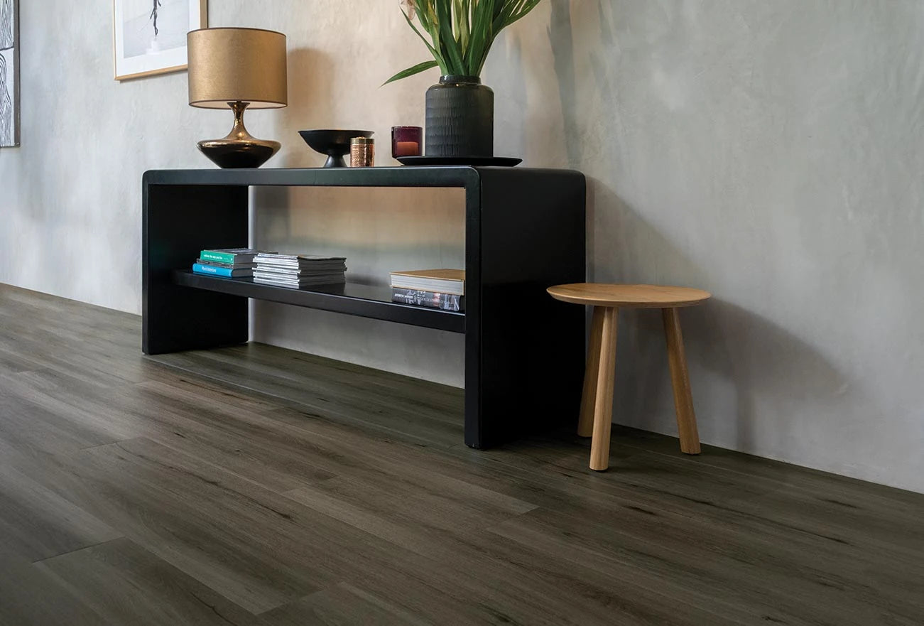 Natural Oak Vinyl Plank Provincial Grey in a modern hallway with a black console table and timber stool