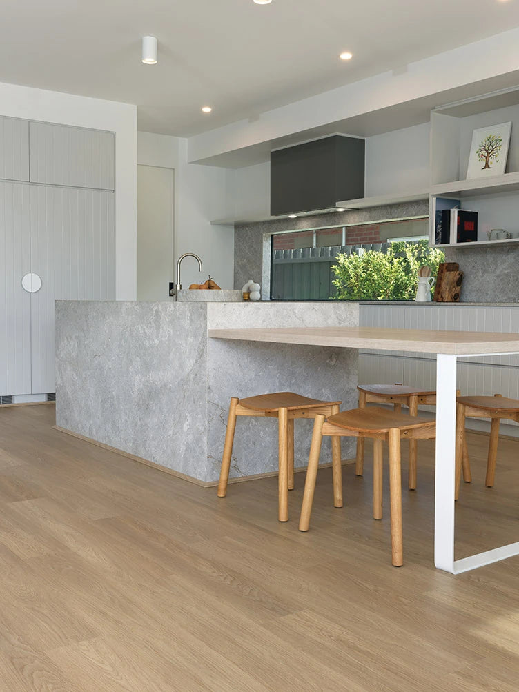 Summerhill Hybrid Plank Brown Maple in a modern kitchen with a stone island bench and warm timber cabinetry