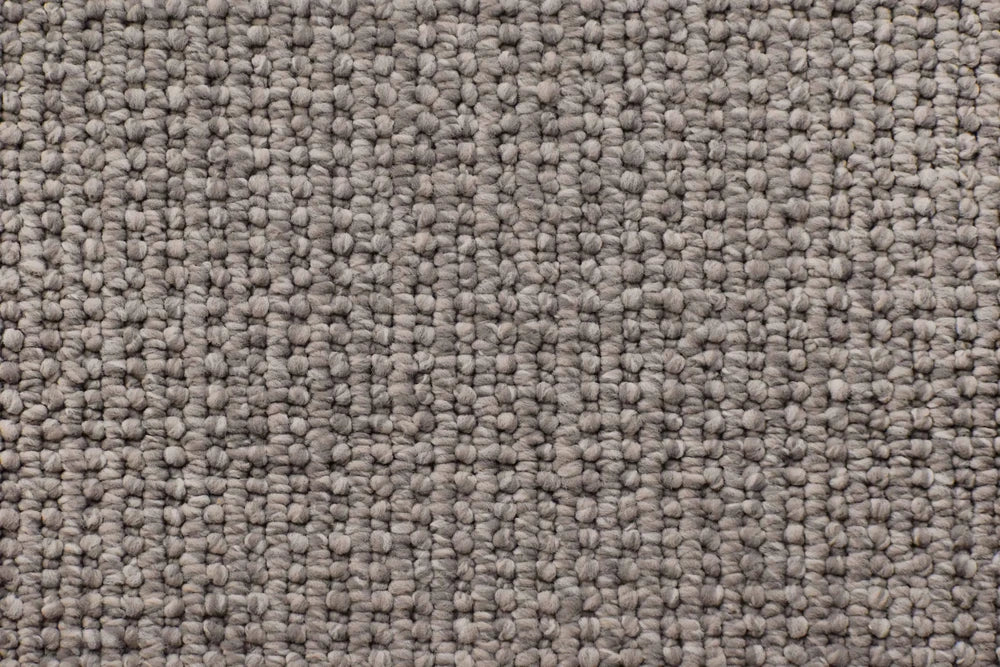 Javelin textured loop carpet, a deeper architectural grey with strong tonal weight and disciplined loop construction, from the Kawana Flooring Victoria Carpets Kirkbridge collection