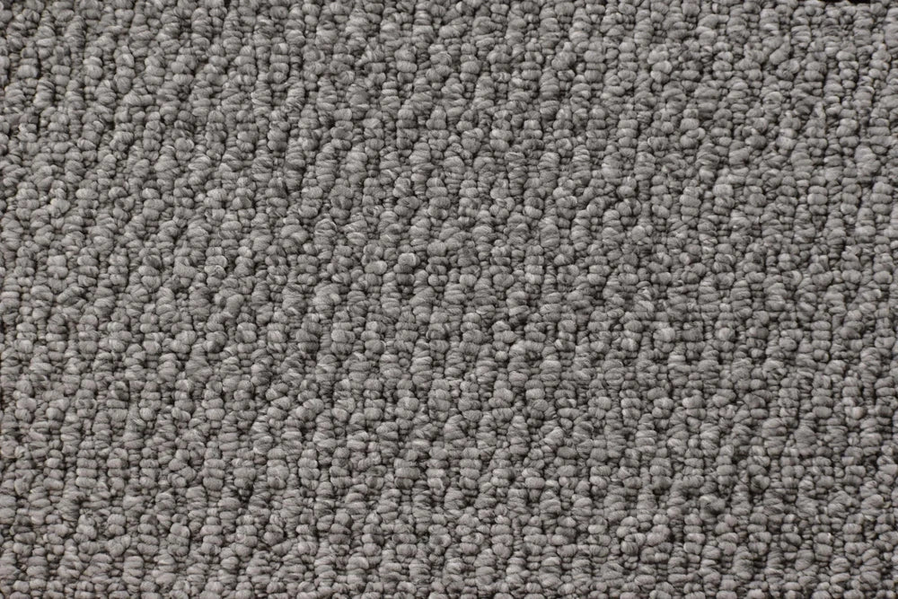 Rampart textured loop carpet, a deep anchoring charcoal with confident architectural weight and dramatic sculpted texture, from the Kawana Flooring Victoria Carpets Lucca collection
